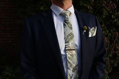 Add a touch of class to your big day with this Olive Green and White Floral Groom Wedding Tie set. Perfectly tailored to give a stylish and classic look, this set will make an impressive addition to any wedding. Timeless and refined, you can be sure that the look of effortless sophistication is always achieved. The Olive Green and White Tropic Tie and Sock Groom Set features hand-chosen high-quality components and is the perfect accessory for any occasion. This set has everything you need to mak Classic Wedding Sets With Ties, Wedding Timeless, Wedding Color Trends, Wedding Tie, Wedding Ties, Tie Set, Touch Of Class, Wedding Groom, Wedding Season