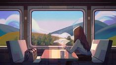 a woman sitting on a train reading a book