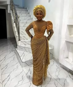 Become a showstopper in this stunning number!  Hand fan and head gear (gele) sold differently.  Please note that custom/luxury dresses cannot be returned or exchanged. All sales are final! ‼️MEASUREMENTS REQUIRED ‼️ Burst Hips  Waist Dress length  Sleeve length  Under burst Shoulder  Please note that the exact fabric might not be available and we will provide similar options  Made with 100% lace Care: Hand wash. Do not bleach Feel free to start a chat for any enquiry. Thanks for visiting. Nigerian African Dresses, Yellow Ball Gown For Wedding, Gold Floor-length Gown For Ceremony, Yellow Floor-length Evening Dress For Wedding, Elegant Yellow Gown For Wedding, Traditional Gold Evening Gown, Gold Floor-length Dress For Ceremony, Gold Floor-length Ceremony Dress, Yellow Evening Dress With Sweep Train For Wedding