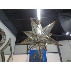 a large metal star hanging from the ceiling