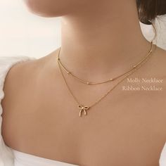 A Delicate Ribbon Pendent Necklace - This listing is for one necklace. Perfect for layering and everyday wear. - Material: High Quality Stainless Steel- Finish: 18k Gold- Measurement: 16" + 2" extender- Nickel Free and Tarnish Free- All our jewelry is packaged in gift-ready boxes. If you would like multiple items from your order packaged separately please let us know!© 2023 Generation of Daughters Minimalist Chain Necklace, Cute Jwellary Aesthetic, Jewelry From Movies, Aesthetic Chains Necklace, Classy Jewelry Gold, Gold Necklace Aesthetic, Ribbon Jewellery, Classy Necklaces, Gold Jewellery Aesthetic