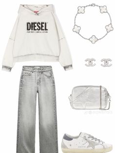 a white sweatshirt and jeans outfit with silver accessories