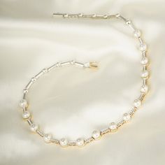 You cannot go wrong with pearls and diamonds, can you? This necklace here is crafted in gold to sit cozily on the nape of your neck, with intermittently placed pearls pierced with diamonds. split Gold(14K) : 15.29g Diamonds : (VS clarity & H-I colour) : (Brilliant cut ) : 0.71ct Gemstone : Chinese Cultured Pearl Silver Alloy split Pearls and diamonds are a match made in heaven! Pair this necklace with your everyday formals or your pastels and you're making an elegant style statement! Elegant Hallmarked Diamond Necklace For Formal Occasions, Elegant Gold Diamond Necklace, Baguette Cut, Elegant Gold Diamond Necklace With Baguette Cut, Elegant Gold Baguette Cut Diamond Necklace, Elegant Gold Baguette-cut Jewelry, Elegant Gold Baguette Cut Jewelry, Elegant Baguette Cut Formal Jewelry, Elegant Baguette Style Jewelry For Formal Occasions, Exquisite Formal Jewelry With Baguette Cut