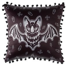 a pillow with a bat on it