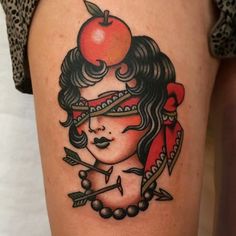 a girl with an apple on her head and arrows in her hair is wearing a red bandana