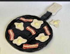 bacon and eggs are being cooked on a pancake