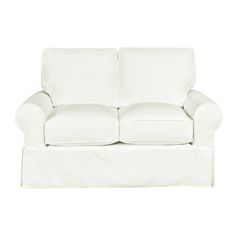 a white couch sitting on top of a white floor