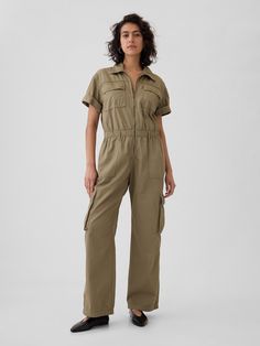 Soft cotton khaki utility jumpsuit.  Point collar, zipper front.  Short rolled sleeves.  Patch pockets at front.  Elasticized waist.  Front slant pockets, back patch pockets.  Side cargo pockets.  Responsibly Made: This khaki jumpsuit is part of our water-saving Washwell program.  Compared with conventional wash methods, Washwell uses at least 20% less water and has saved over a billion liters of water since 2016.  * Fit: Classic.  An easy silhouette throughout.  Models wearing Gap Khaki Jumpsuit, Beige Jumpsuit, Shirt Jumpsuit, Short Sleeve Jumpsuit, Utility Jumpsuit, Boiler Suit, Short Sleeve Jumpsuits, Suit Fabric, Work Wear Women