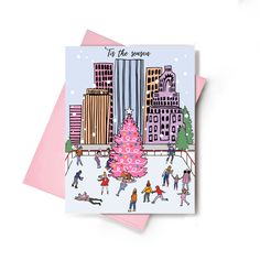 a christmas card with people skating on the rink in front of a cityscape