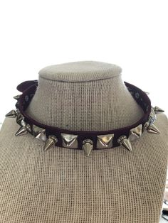 "Punk choker with alternating 1/2\" tree spikes and 1/2\" pyramid studs. Studs and spikes are nickel plated brass. All other hardware is nickel plated. Neckband is 5/8\" wide. Made with hand dyed vegetable tan leather." Spiked Choker For Concerts, Small Spiked Choker, Spike Choker, Punk Choker With Spikes, Black Spiked Choker, Studs And Spikes, Tan Leather, Fedora, Hand Dyeing