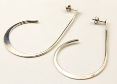 - Vintage beautifully artisan crafted sterling silver modernist half hoop earrings- Earrings are marked "Sterling TH"- Earrings measure 2.75" tall by 1.55" deep and .7mm thick- Together earrings weigh 7.7 grams- Sterling Silver shows fine scratches from age and wear Modern Spiral Hoop Earrings, Modern Handmade Hoop Earrings For Anniversary, Contemporary Sterling Silver Hoop Earrings, Modern Hand Forged Hoop Earrings, Contemporary Sterling Silver Hoop Earrings As Gift, Handmade Modern Hoop Earrings For Anniversary, Contemporary Sterling Silver Hoop Earrings For Gift, Modern Hand Forged Hoop Earrings Gift, Modern Hand Forged Hoop Earrings For Gift