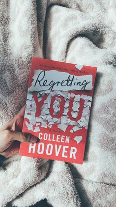 someone is holding up a copy of the book reposting you by colleen hoover