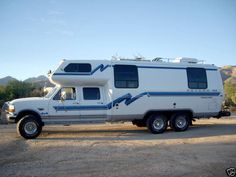 an rv parked in the middle of a parking lot