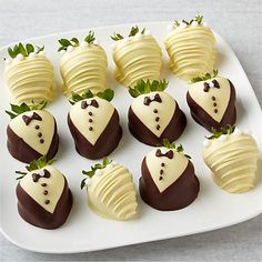 chocolate covered strawberries are arranged on a white plate