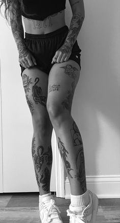 a woman with tattoos on her legs and knees