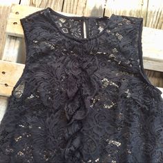 Never Worn Black Lace Ruffle Front Sleeveless Top By Whowhat Wear High Round Neckline Ruffled At Center Front Back Button Closure 100% Polyester Wear Over A Bralette Or Cami Or Over A Fitted Shirt Small Sleeveless Black Ruffled Tank Top, Black Ruffled Sleeveless Tank Top, Black Sleeveless Ruffled Tank Top, Black Ruffled Tank Top, Black Sleeveless Top With Ruffles, Black Sleeveless Ruffled Top, Elegant Black Tank Top With Ruffles, Elegant Black Ruffled Tank Top, Chic Black Ruffled Tank Top