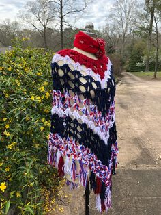 "70's Ponchos/Hippie Ponchos/Boho Ponchos/Lightweight Ponchos/Multi Ponchos/70's Vintage Ponchos/Vintage Ponchos/NEAR MINT CONDITION 1970's Red/White/Blue Handmade Poncho Hippie Boho Poncho Handmade Crocheted Lightweight Poncho This is a Great Long Length of 34\" from just Below the Neck. Measurements - Bust (entire width) - 52\" Length - 34\" from just below the Neck to the Longest Point in the Center NEAR MINT CONDITION - The Colors in this Poncho are Beautiful! It is listed as near mint condi Red Bohemian Poncho For Festival, Bohemian Red Cape For Festivals, Hippie Shawl Poncho For Festivals, Red Bohemian Poncho Cape, Red Bohemian Cape Poncho, Red Bohemian Shawl Cape, Bohemian Red Shawl Cape, Red Poncho For Beach In Fall, Bohemian Poncho Cape One Size