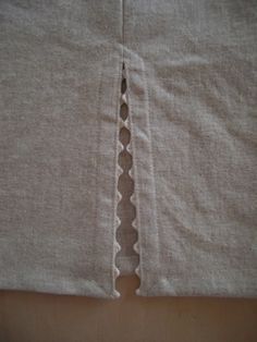 the side of a piece of cloth with holes cut in it