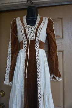 "Gunne sax prairie dress. Zips in the back and ties a the waist. Gunne's size 7 - fits small- please see measurements. Condition - has some spots - see photos - (I don't think they can be removed). Measurements taken across front laid flat 16\" across front armpit to armpit 14\" across front of waist (ties tighter) 55\" length" Vintage Lace Costume Dress, Vintage Lace Dress For Costume, Vintage Fitted Long Sleeve Corset Dress, Vintage Long Sleeve Fitted Corset Dress, Fitted Vintage Dress With Lace Trim For Fall, Fall Vintage Fitted Dress With Lace Trim, Fitted Long Sleeve Lace Prairie Dress, Vintage Lace Trim Costume Dress, Fitted Vintage Dress With Lace Trim For Costume