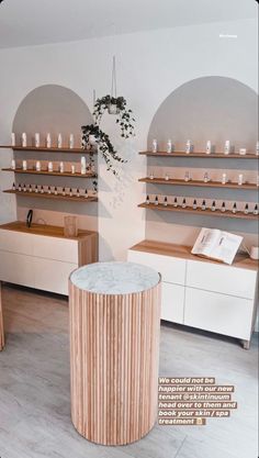 a room filled with lots of wooden shelves and counter top space next to each other