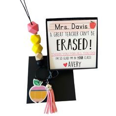 a teacher appreciation card and keychain with an apple hanging from it's back