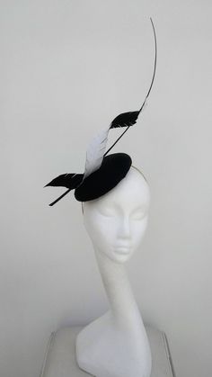 Classic, less is more, dramatic elegance.  This black and white monochrome fascinator is a real statement piece.  Black medium size pillbox base is adorned with a black and white twisted petal, whilst a black quill winds its way through as it shoots for the sky.  Sits on a headband This item has sold, however, similar pieces can be made in a variety of colours.  Please ask for details.  As every piece is handmade, some differences can occur from the photos listed on this site.  Made to order/bes Black And White Fascinator, White Fascinator, Sinamay Hats, Derby Fascinator, Couture Hats, Bride Hat, Bride Headpiece, Hat Fascinator, Hats And Fascinators