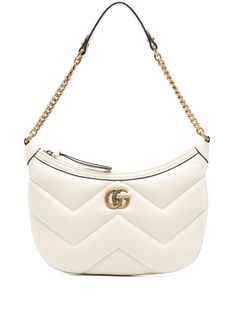 cream white calf leather smooth grain matelassé effect top zip fastening leather and chain-link shoulder strap signature Double G logo main compartment internal slip pocket microfibre lining We've partnered with Good On You — an independent agency that rates how brands perform in relation to their impact on the planet, people and animals, with a multi-criteria rating simplified to a five points scale. In order to be awarded our conscious label, larger brands need to score a minimum of four out of five ('Good'), while smaller brands must score at least three out of five ('It's A Start'). This item comes from a brand rated three out of five ('It's A Start') by Good on You at the time it was added on FARFETCH. Please note, this is a brand-level rating and does not guarantee that this product Gg Marmont Small Shoulder Bag, Double G Logo, G Logo, Planet People, Gucci Gg Marmont, Gucci Shoulder Bag, Gg Marmont, Small Shoulder Bag, Gucci Bags