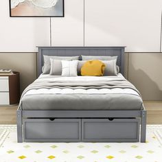 a bed with two storage drawers underneath it