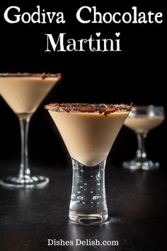 three martini glasses filled with white chocolate and topped with toasted pecansia, on a black surface