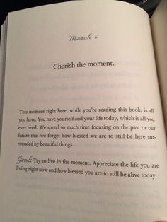 an open book with the words cherish the moment