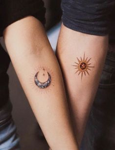 two people holding hands with tattoos on their arms and one has a sun and moon