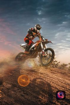 a man riding on the back of a dirt bike