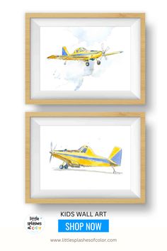 two yellow and blue airplanes are hanging on the wall in front of a white background