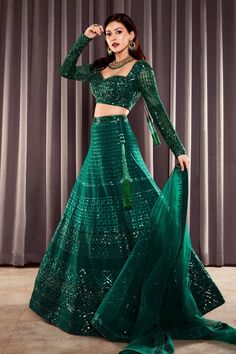 Emerald green lehenga in net base with geometric motif sequin embroidery. Paired with sweetheart neck, long sleeved choli and dupatta.
Components:3
Pattern:Embroidered
Type of Work:Sequins
Neckline:Sweetheart
Sleeve Length:Long
Fabric:Net
Color:Green
Other Details:
Back cut-out choli
Tassel edged dupatta
Occasion:Wedding, Bride - Aza Fashions Emerald Green Indian Outfit, Green Lehenga Bridal, Green Indian Outfit, Emerald Green Lehenga, Green Bridal Lehenga, Wedding Guest Dresses Uk, Green Dress Makeup, Lengha Dress, Indian Wedding Guest Dress