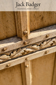 an old wooden door with the words jack badger written on it's side panel