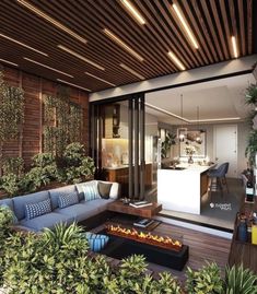 an outdoor living area with couches, tables and potted plants