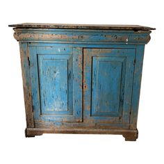 an old blue cabinet is shown against a white background