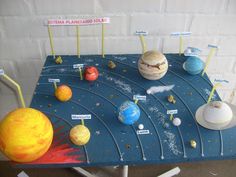 the solar system is made out of clay and paper machs on a blue table