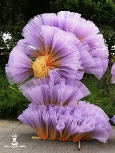 purple flowers are arranged in the shape of letters