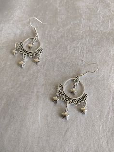 These gorgeous, dainty drop earrings feature filigree charms decorated with mini stars, like a night sky. Choose between silver or bronze! Mini Stars, May 23, Houston Tx, Night Sky, Night Skies, Starry Night, The Dreamers, Houston, Etsy Earrings