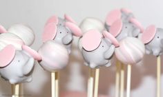 several marshmallows with pink ears on top of each other in the shape of elephants