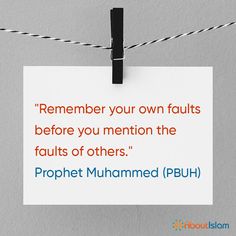 a piece of paper hanging from a clothes line with the quote, remember your own fault before you mention the faults of others