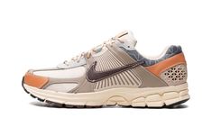 The Nike Zoom Vomero 5 “Sanddrift/Muslin” is a colorway of the retro performance running shoe with an earth tone color scheme for versatility.  The Zoom Vomero 5 debuted in 2010 before becoming part of the Y2K sneaker trend beginning in 2022.  Here, the shoe features a canvas, leather, suede, and TPU construction in tan and brown hues.  Japanese Sashiko fabric appears on the collar, while a brown leather Swoosh can be found on the sides.  “Nike Vomero 5” branding appears on the tongue.  A Zoom A Sashiko Fabric, Nike Zoom Vomero 5, Zoom Vomero 5, Nike Vomero, Sneaker Trend, Vomero 5, Earth Tone Color, Spaghetti Strap Bodycon Dress, Earth Shoes