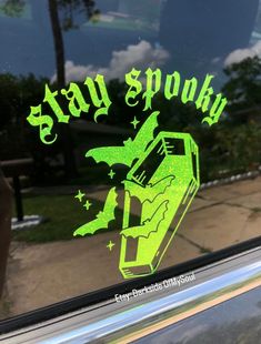 a sticker that says stay spooky on the side of a car window