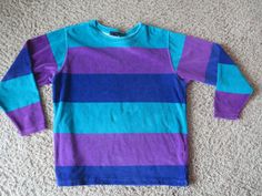 Great item.  Vintage.  Has that late 80's/early 90's look and colors.  This is a combination of a shirt and a sweatshirt.  Material is soft and almost has a terry cloth texture, or something like that.   78% cotton/22% polyester. Women's medium (appears fairly large for a medium, but probably is supposed to be worn big. See measurements). pit to pit: 23" top of shoulder to bottom front: 27" Good condition.  Some light signs of use. Retro Long Sleeve Color Block Tops, Retro Color Block Long Sleeve Tops, Purple 90s Style Tops For Fall, Purple 90s Style Top For Fall, Retro Purple Long Sleeve Sweater, Purple Long Sleeve 90s Style Top, Purple Long Sleeve 90s Top, 90s Style Multicolor Long Sleeve Sweatshirt, 90s Inspired Long Sleeve Cotton Top