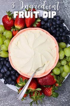 a fruit dip in a bowl surrounded by grapes, strawberries and blueberries with the words 3 ingredient fruit dip