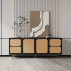 the sideboard is made out of wood and has three panels on each side, along with an abstract painting