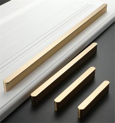 three different types of handles on a black surface