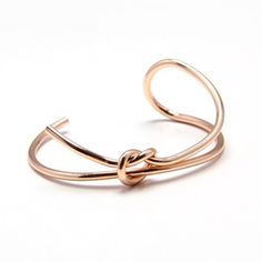 Classic design with a modern flair, our Knotty or Nice Cuff is minimalist jewelry at its finest. This is the bracelet you will be grabbing day after day! Material: Copper Finish: Gold Plated, Silver Plated, Matte Black Adjustable Modern Rose Gold Bangle, Chic Rose Gold Metal Cuff Bracelet, Adjustable Minimalist Metal Cuff Bracelet, Adjustable Rose Gold Minimalist Cuff Bracelet, Trendy Rose Gold Cuff Bracelet Gift, Modern Rose Gold Cuff Bracelet As Gift, Modern Rose Gold Cuff Bracelet Gift, Minimalism Design, Double Knot