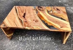 a coffee table made out of wood on the ground